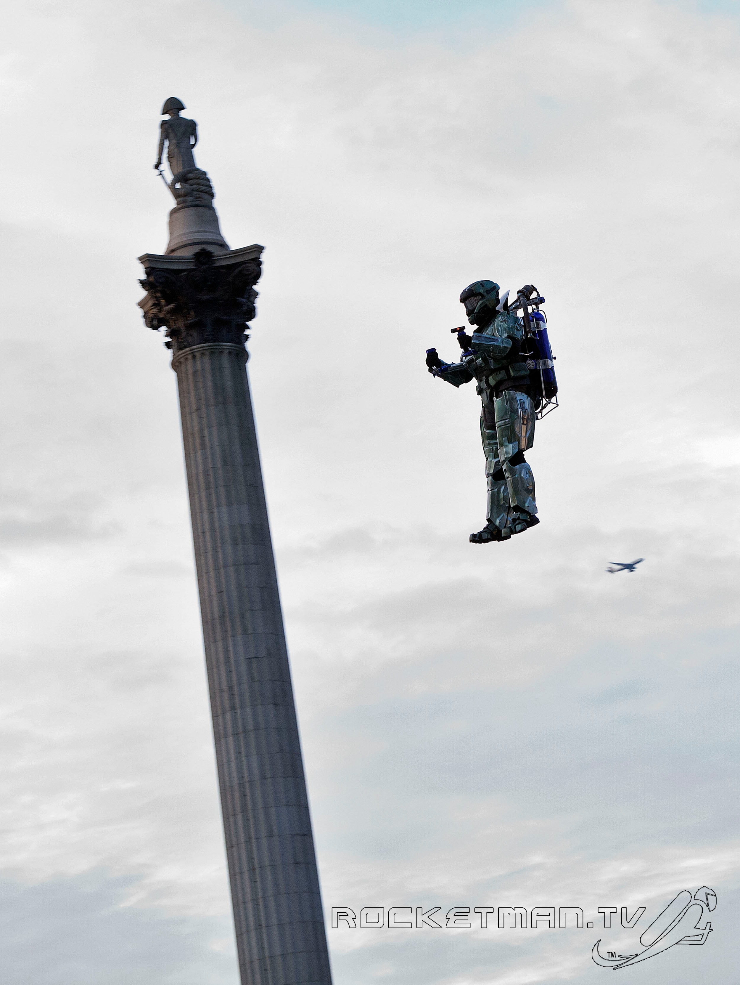 The Rocketman in Halo armor flying over Trafalgar Square