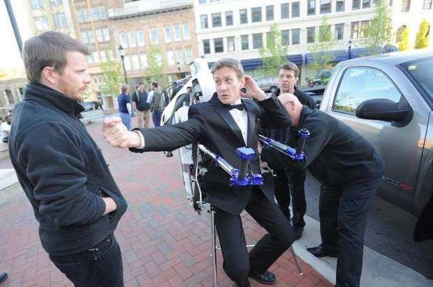 The Rocketman in a tuxedo with the rocketbelt at a James Bond event